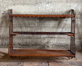 This lot features a Victorian three-tier wall shelf that measures, 25.5” H x 32” W x 6.5” D.
