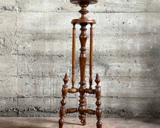This lot features a Victorian carved mahogany torchere in excellent condition and measures, 37.25” H x 10” W x 10” D.
