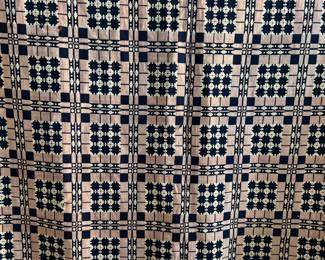 This lot features an incredible 19th century Welsh double-cloth "tapestry" blanket, with the iconic Caernarfon pattern. This design is one of the most recognizable traditional Welsh patterns, dating back to the early 19th century. This item can be used as a rug, blanket, hung as a work of art, or however you’d like to display and use it. Minor holes throughout, but in good overall condition for its age. This piece measures, 84” H x 74” W.
