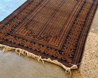This lot features a Baluch prayer rug in very good condition. This rug was gifted by a Saudi Arabian official as a gesture of thanks for his time as Consul General during a social engagement. This Baluch rug measures, 78” H x 47” W. 
