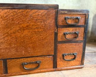 This lot features a Japanese hibachi cabinet with five (5) drawers, and a removable glass lid above the copper lined well. This cabinet measures, 14” H x 28” W x 15” D.
