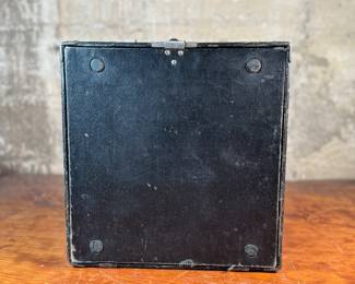 This lot features an antique Remington portable typewriter with a four-bank QWERTY keyboard, a folding type bar mechanism that raises the type bars for typing and lowers them for storage, making the machine compact, and housed in a carrying case. These typewriters were among the earliest and most successful portable models, first introduced in 1920.
