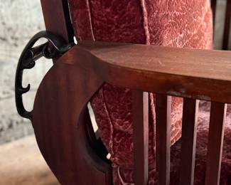 This lot features a stunning antique Morris chair with an adjustable back, removable cushions, and a spindle design on the sides with carved paw feet. This chair measures, 39” H x 31” W x 30.5” D.
