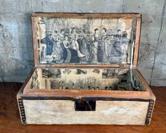 This lot features an antique trunk, most likely an immigrant trunk circa 1890s. The trunk is made of wood and animal hide with a lined paper interior. This trunk measures, 8” H x 21” W x 10.5” D.
