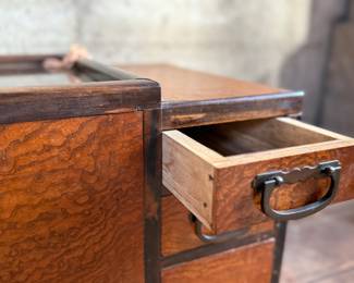 This lot features a Japanese hibachi cabinet with five (5) drawers, and a removable glass lid above the copper lined well. This cabinet measures, 14” H x 28” W x 15” D.
