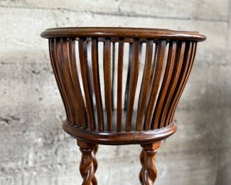 This lot features an antique solid wood barley twist fern stand in very good condition and measures, 32” H x 15.5” W x 15.5” D.
