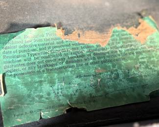 This lot features an antique Remington portable typewriter with a four-bank QWERTY keyboard, a folding type bar mechanism that raises the type bars for typing and lowers them for storage, making the machine compact, and housed in a carrying case. These typewriters were among the earliest and most successful portable models, first introduced in 1920.
