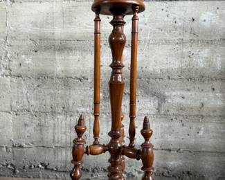 This lot features a Victorian carved mahogany torchere in excellent condition and measures, 37.25” H x 10” W x 10” D.
