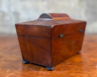 This lot features an antique English double tea caddy, likely Georgian and measures, 5.5” H x 8” H x 4.25” D. Tea caddies were popular in the 18th and 19th centuries when tea was a valuable commodity.
