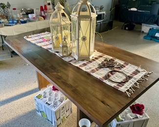 Kitchen table, no chairs, farmhouse style, lanterns, glassware 