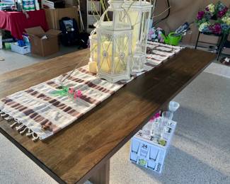 Kitchen table, no chairs, farmhouse style, lanterns, glassware 
