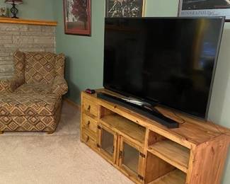 Flat screen TV and pine stand