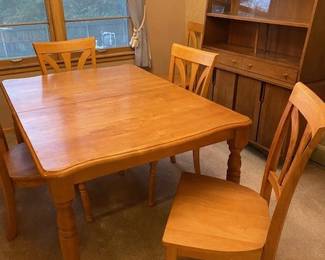 Solid wood table and six chairs, extra leaf stored under the table top