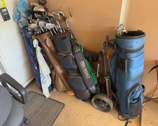 Several sets of golf clubs