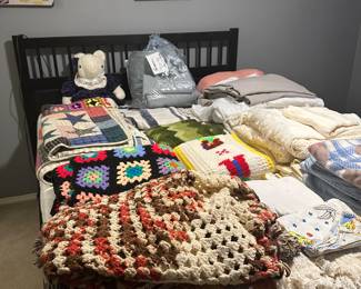 Artwork, quilts, blankets , afghans , beautiful bed and dresser ,