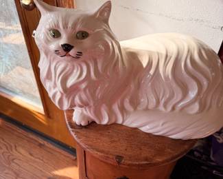 cat laying down and one sitting down beautiful