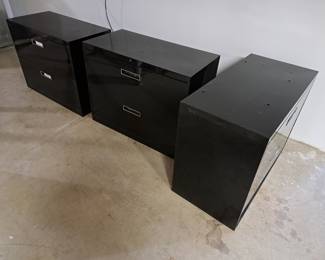 three metal file cabinets