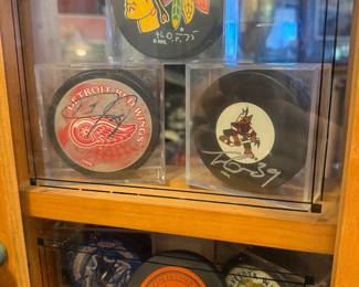 SIGNED HOCKEY PUCKS