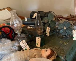 Antique oil lamps, fans and creepy dolls.