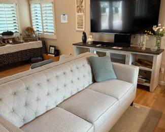 Beautiful Lazy Boy Sofa.  There are Two of them!
75” Samsung 4k TV
TV console