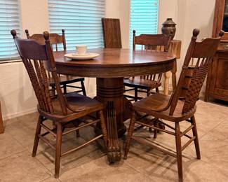 Round wood table with chairs and leaf