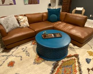 Haven Leather Sofa, blue carved round coffee table, Rug and accessories