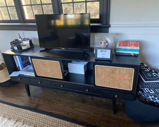 Black and rattan TV Stand or storage display unit. smart TV, books and accessories.