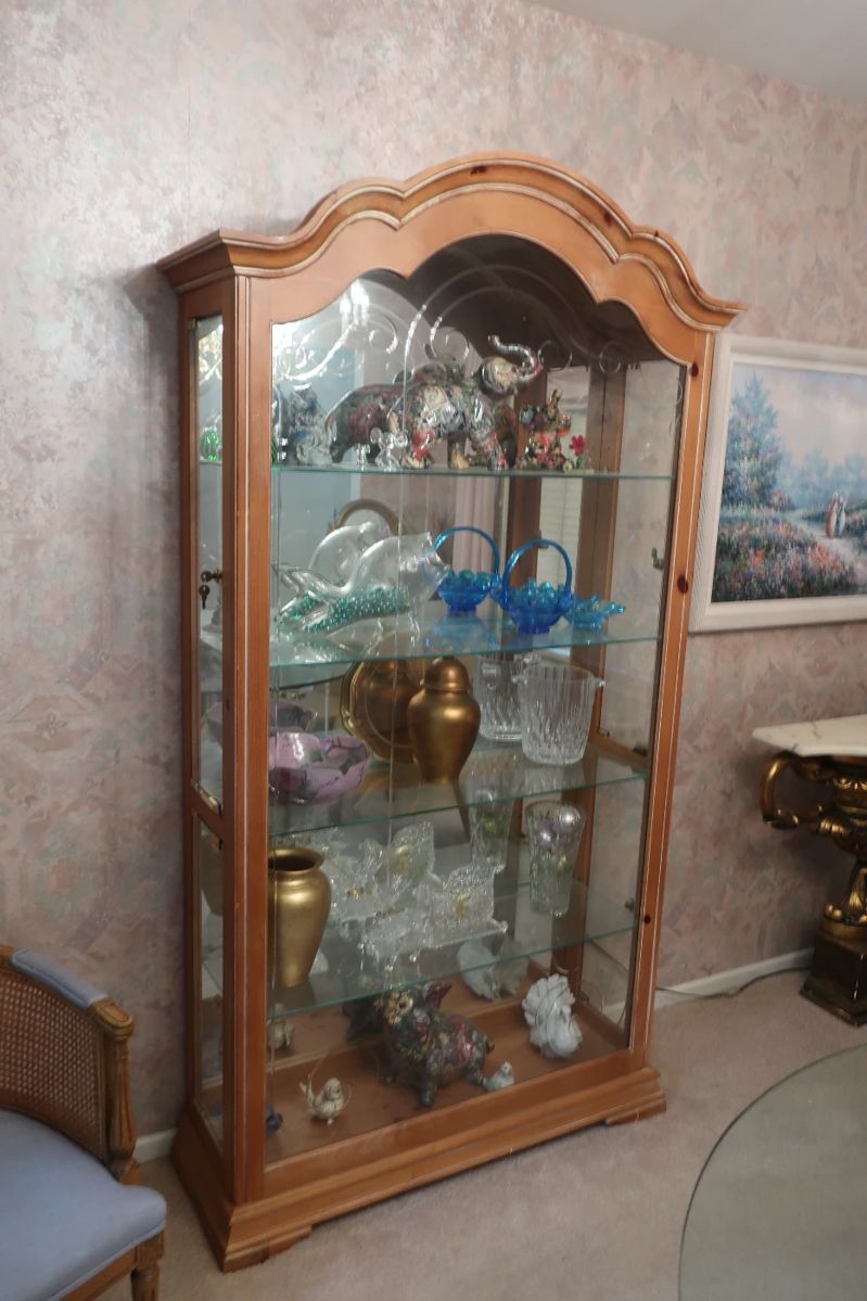 curio cabinet 40" w x 13" deep x 79 ' tall" It opens at front and sides.
