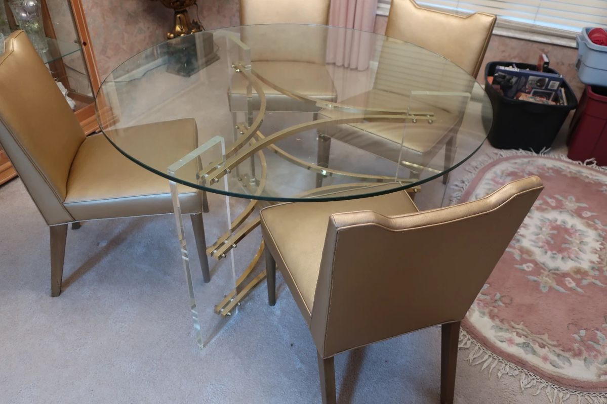 50"  glass  top  table  with lucite bases.          Hollis  Jones  mid  century  table.   It  has  4  chairs.