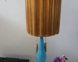 tall  blue  lamp  with  gold  shade
