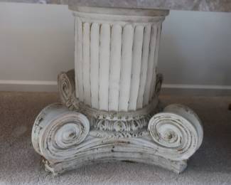 base  below  marble  top  display  piece