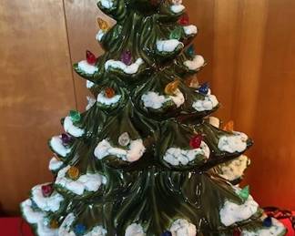 Vintage ceramic light up Christmas tree, snow flocked with multi-colored bulbs.