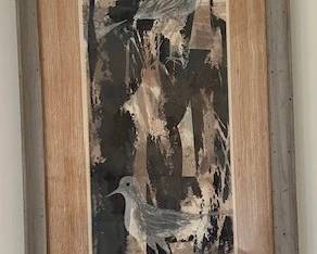 Abstract framed art with bird motifs.