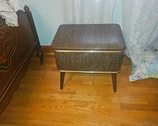 Upstairs, end of hallway bedroom. Contents convey. MCM sewing bench