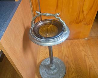 Upstairs. Note, glass ashtray is broken. Caution when handling