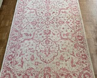Rachel Zoe Los Angeles | New York wool pile rug, handmade in India. Measures 5 ft. x 8 ft. Features a warm rose and ivory traditional pattern. 100% wool pile, non-transferable backing. 