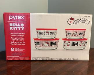 Pyrex Hello Kitty 8-piece decorated glass food storage set. Includes 4 containers with red lids in assorted sizes and Hello Kitty designs. New in box. 