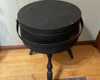 Vintage wooden sewing stand with removable top and turned legs. Painted black with surface wear from age. Approx 24" x 15"
