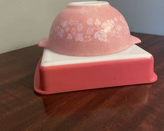 Two Pyrex pieces: (1) pink Gooseberry Cinderella mixing bowl; (2) solid-pink refrigerator dish base only (no lid). Has some wear on both of them. 