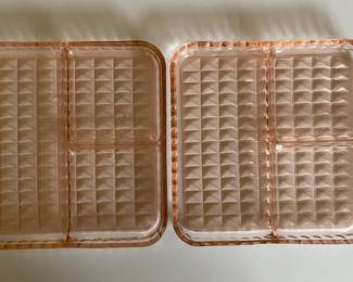 Set of two pink Depression glass divided plates featuring a raised geometric pattern.