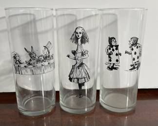 Set of three glass tumblers featuring black-and-white illustrations from Alice in Wonderland.