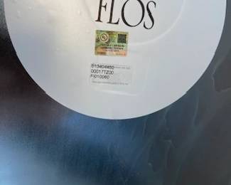 Spun Floor Lamp designed by Sebastian Wrong. High-gloss paint, 69" H. DWR retail price: $3,045. Sculptor and designer Sebastian Wrong demonstrates his flair for bold, minimalist forms in his Spun Lamp (2001) for Flos. This lamp features satin-smooth, high-gloss machined aluminum for maximum dramatic impact. The fluid pedestal base stabilizes the design, and the full-range on-cord dimmer provides infinitely variable light. Bulb (not included): incandescent 240W/A21/E26 or comparable CFL/LED. Made in Italy.