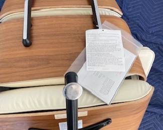 Tags still on! "Eames Leather Lounge Chair and Ottoman" Designers: Charles and Ray Eames. DWR  List Price: $11,710.00. 
Materials: Walnut wood with Ivory leather. 