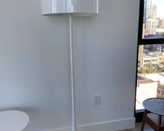 Spun Floor Lamp designed by Sebastian Wrong. High-gloss paint, 69" H. DWR retail price: $3,045. Sculptor and designer Sebastian Wrong demonstrates his flair for bold, minimalist forms in his Spun Lamp (2001) for Flos. This lamp features satin-smooth, high-gloss machined aluminum for maximum dramatic impact. The fluid pedestal base stabilizes the design, and the full-range on-cord dimmer provides infinitely variable light. Bulb (not included): incandescent 240W/A21/E26 or comparable CFL/LED. Made in Italy.