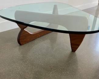 Noguchi Coffee Table designed by Isamu Noguchi. Glass and walnut. DWR retail price $2,295.00. 