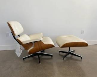 Tags still on! "Eames Leather Lounge Chair and Ottoman" Designers: Charles and Ray Eames. DWR  List Price: $11,710.00. 
Materials: Walnut wood with Ivory leather. 