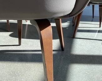 Saarienen Executive Armchair x 6. Designed by Ero Saarinen. A total of 6 chairs avaiable. Walnut wood legs and taupe leather upholstery. DWR retail price: $3,295.00 each.