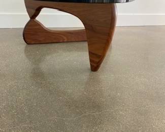 Noguchi Coffee Table designed by Isamu Noguchi. Glass and walnut. DWR retail price $2,295.00. 