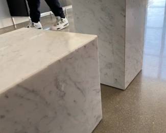 Plinth Side Tables designed by Norm Architects. Material: White carrara marble - We have 1 that is short and 1 that is tall.  2 to sell total. Both list at retail for $1,625.00. 