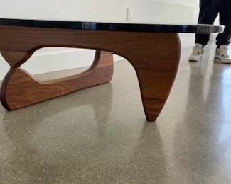 Noguchi Coffee Table designed by Isamu Noguchi. Glass and walnut. DWR retail price $2,295.00. 